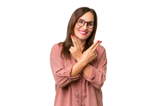 Middle-aged caucasian woman over isolated background smiling and showing victory sign