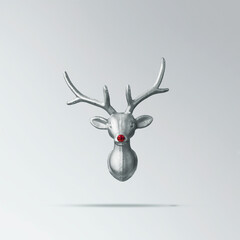 Christmas reindeer concept on white background made of reindeer with  red bauble on its nose....