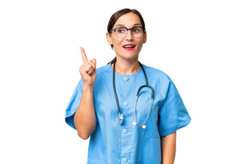 Middle-aged nurse woman over isolated background intending to realizes the solution while lifting a finger up