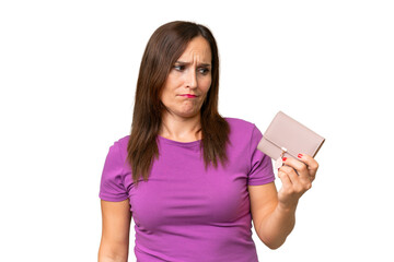Naklejka premium Middle-aged caucasian woman holding a wallet over isolated background with sad expression