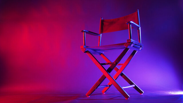 Black Director chair in red and blue light color with black background