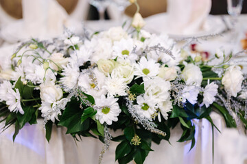 Beautiful flowers on wedding table in restaurant