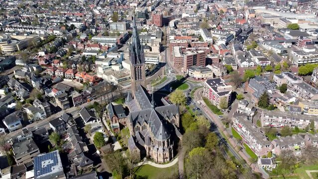 Aerial view of famous church in Hilversum the Netherlands the Saint Vitus or Sint Vituskerk has been completed in 1890 and has a 322 feet tall bell tower and is located in the city center 4k