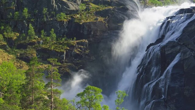Magnificent nature of Norway. Hardangervidda National Park. Norway landscape with waterfall, river and mountains. 4K, UHD slow motion