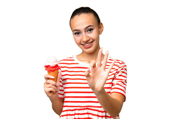 Young Arab woman with a cornet ice cream over isolated background happy and counting three with fingers