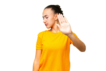 Young Arab woman over isolated background making stop gesture and disappointed