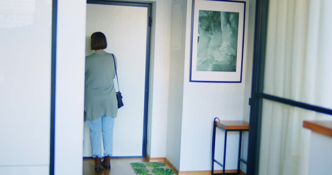 Woman preparing for leaving house checking her stuff
