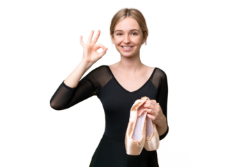 Young English woman practicing ballet over isolated background showing ok sign with fingers
