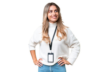 Young Uruguayan woman with ID card over isolated background thinking an idea while looking up