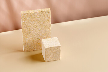Natural Stone Podiums for promotion on beige Background. Beauty product mockup. Scene, blank for show products. Showcase, display case, pedestals with window shadow.