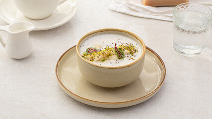 Portion of healthy sweet porridge with pears and herbs