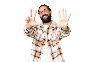 Young man with beard over isolated chroma key background counting eight with fingers
