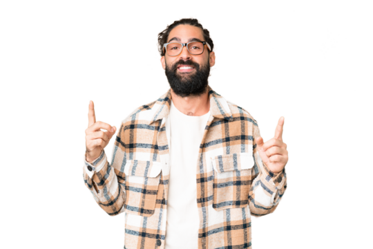 Young man with beard over isolated chroma key background pointing up a great idea