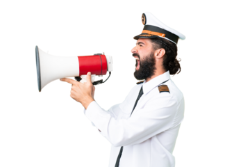 Airplane caucasian pilot man over isolated chroma key background shouting through a megaphone