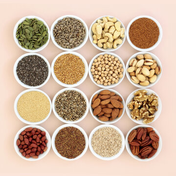 Plant Based Health Food High In Lipids. Ingredients Contain Unsaturated Fats For Healthy Heart And Cholesterol Levels With Nuts, Seeds, Legumes And Grain. On Neutral Background.