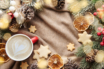 Christmas and winter cozy background with warm sweater and decorations.