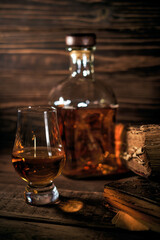 Whisky still life on a wooden background