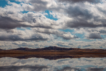 view of spawning in the lake, mountains