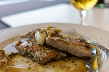 Grilled tuna steak in herb garlic and lemon marinade