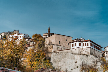 Fototapeta premium Traditional Ottoman Houses in Safranbolu. Ottoman houses and old mosuqe. Safranbolu UNESCO World Heritage Site. Old wooden mansions turkish architecture. Safranbolu landscape view.