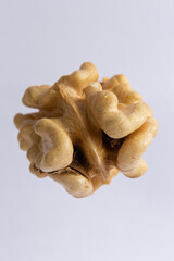 dry peeled walnut on white background