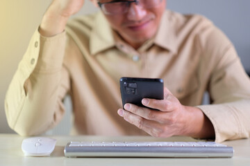 Man using smartphone at home. businessman texting on mobile phone in room. Communication, home work or study, connection, mobile apps, technology, lifestyle concept