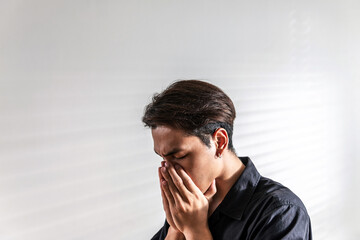 stress asian man nervous headache alone. loneliness frustration male person suffering from isolated tired pressure indoors. lonely attractive mental people depressed pain sad grief with difficulty