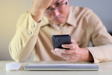 Man using smartphone at home. businessman texting on mobile phone in room. Communication, home work or study, connection, mobile apps, technology, lifestyle concept