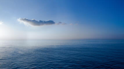 Fototapeta premium A Cloud Above the Infinite Blue