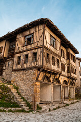 Fototapeta na wymiar Traditional Ottoman Houses in Safranbolu. Safranbolu UNESCO World Heritage Site. Old wooden mansions turkish architecture. Safranbolu landscape view.