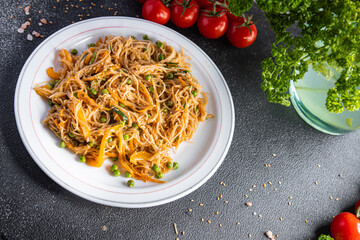rice noodles vegetables no meat Asian dish fresh funchose snack meal food snack on the table copy space food background rustic top view