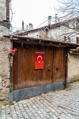 turkish houses wooden door and turkish flag. Old houses wooden door vintage. safranbolu house