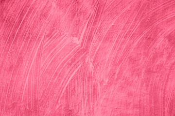 Fototapeta premium Viva Meganta toned red magenta rustic texture of damage wall. Vintage abstract field of erased paint. Cracks from plaster. Trendy color of the year 2023. Fashion color pattern