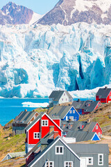 Picturesque village on coast of Greenland - Colorful houses in Tasiilaq, East Greenland © muratart