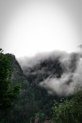 Fototapeta na wymiar Cloud covered mountains and valleys 