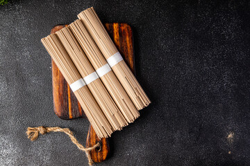soba raw buckwheat noodles Asian dish snack healthy meal food snack on the table copy space food background rustic top view