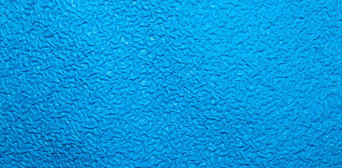 Fototapeta na wymiar The texture is swollen blue rubber.The texture is blue rubber foam.Sound insulation of the rubberized blue surface.