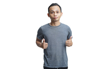 young asian man showiwng thumbs up gesture on isolated background
