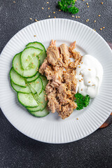 tuna salad, cucumber and yogurt or sour cream snack meal food snack on the table copy space food background rustic top view