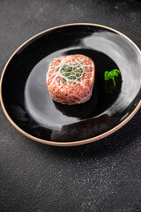 meat cutlet in fat grid fatty mesh pork, beef raw minced meat and spice fresh snack meal food snack on the table copy space food background rustic top view