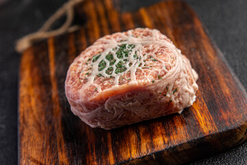 meat cutlet in fat grid fatty mesh pork, beef raw minced meat and spice fresh snack meal food snack on the table copy space food background rustic top view