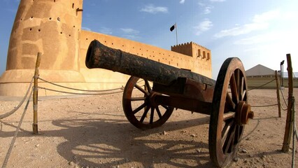 Cannon of the old castle Al Zubara Fort, a historic Qatari military fortress, Middle East, Arabian Peninsula of Persian Gulf in North of Qatar.