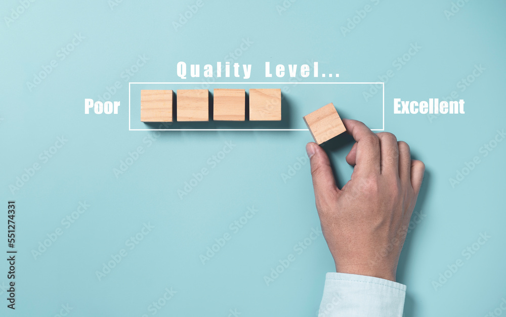 Poster Businessman array wooden block cube for increasing quality level from poor to excellent , Continuous quality improvement concept.