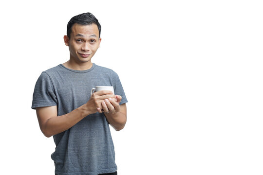 Handsome Asian Man Holding Cup Of Coffee On Isolated Background