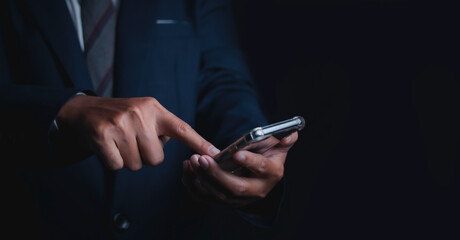 Businessman using smartphone.