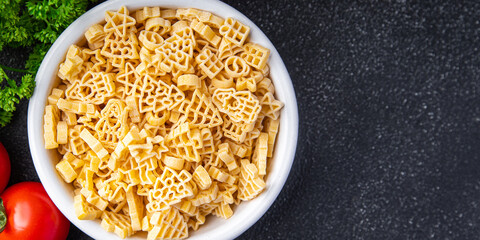 christmas shape pasta festive food spruce, star, santa, snowman delicious snack meal food snack on the table copy space food background rustic top view