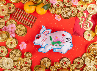 Tradition Chinese cloth doll rabbit,2023 is year of the rabbit,Chinese golden characters Translation:good bless for year of the rabbit,word on golden coin Translation:good luck for money