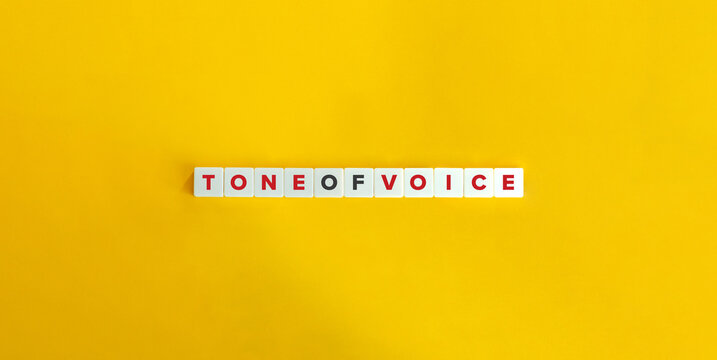 Tone of Voice Phrase in Branding. Letter Tiles on Yellow Background. Minimal Aesthetics.