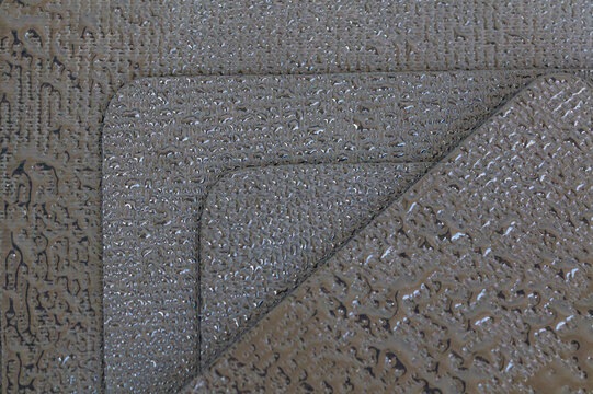 Raindrops falling on rubber plates. EPDM rubber membrane