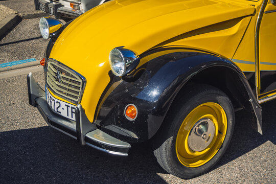 Loriol sur Drome, France - 17 September, 2022: Vintage black and yellow Citroen 2cv6 Charleston, on the street. Classic car exhibition in Loriol sur Drome, France.